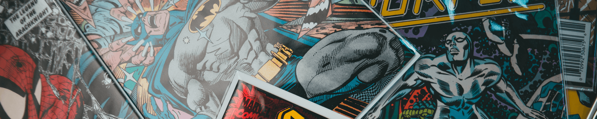 various comic books: Batman, Silver Surfer, Spiderman
