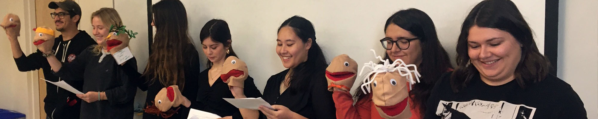 students in a class with puppets